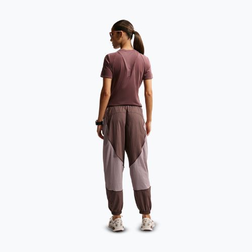 Spodnie do biegania damskie Nike Swift UV Repel Mid-Rise tattoo/light violet ore