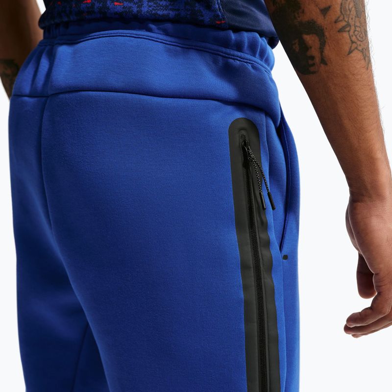 Spodnie piłkarskie męskie Nike FFF Tech Fleece Joggers game royal/metallic copper 5