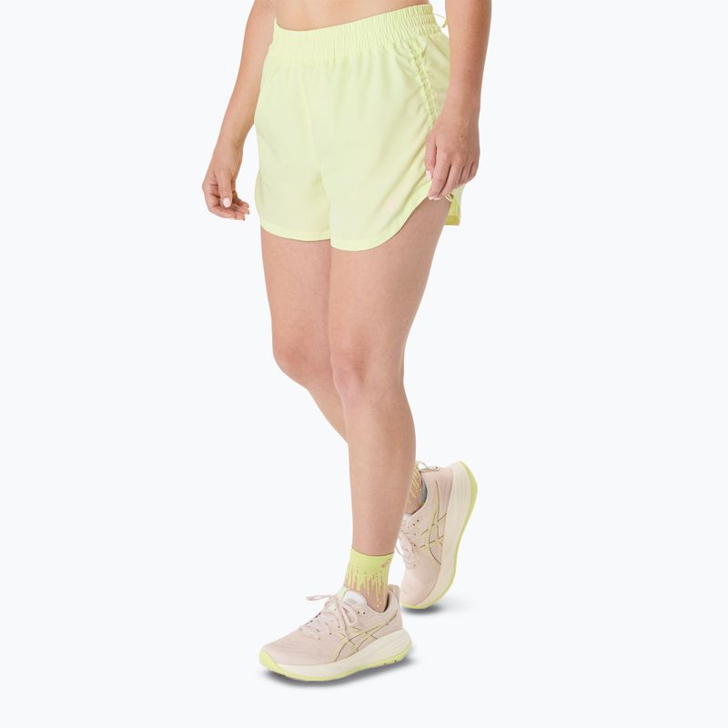 Spodenki do biegania damskie ASICS Nagino Run Adjustable 4IN huddle yellow 4